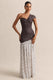 ECM_HR_CL137323021----Motira-_-Brown-Polka-Dot-Asymmetric-Neck-Maxi-Dress-With-Asymmetric-Drop-Waist-1_HERO_1.jpg